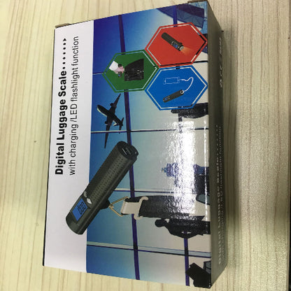 Digital luggage scale packaging on a wooden surface